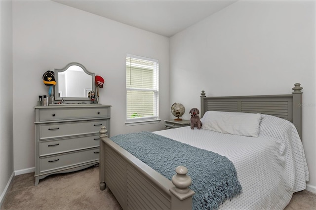 bedroom with light colored carpet