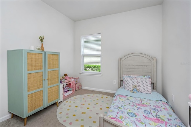 bedroom featuring light carpet