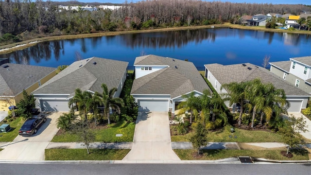 drone / aerial view with a water view