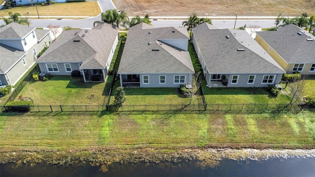 aerial view featuring a residential view and a water view