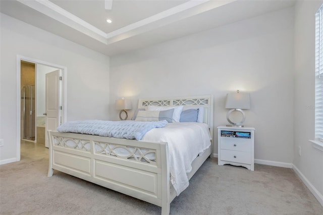 carpeted bedroom featuring recessed lighting, a tray ceiling, and baseboards