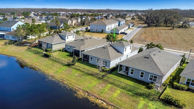 bird's eye view with a residential view and a water view