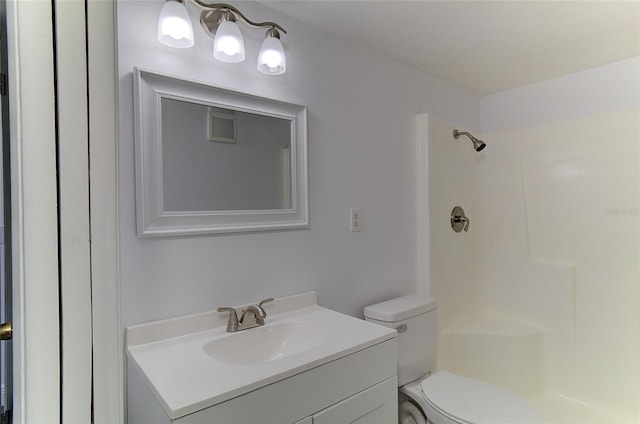 bathroom featuring oversized vanity and toilet