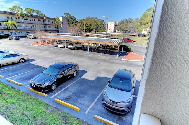 view of parking featuring a carport