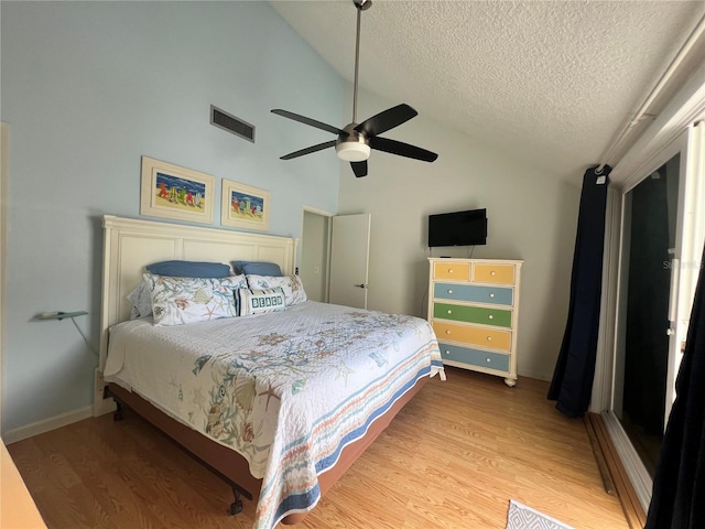 bedroom with high vaulted ceiling, wood-type flooring, ceiling fan, and a textured ceiling