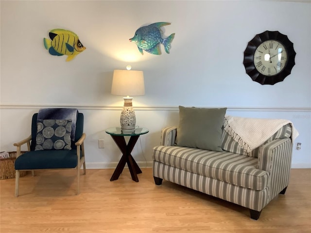 sitting room featuring light hardwood / wood-style flooring