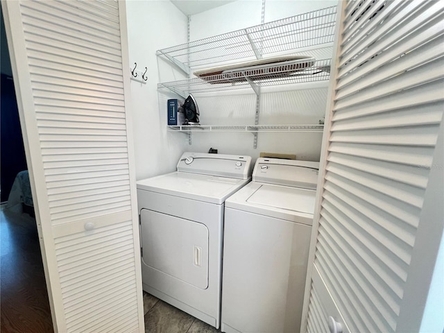 clothes washing area featuring independent washer and dryer