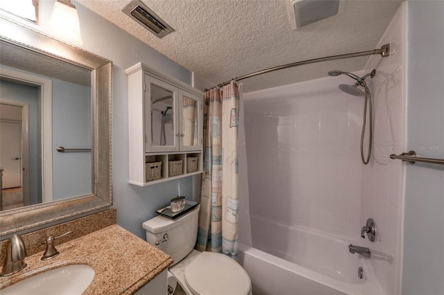 full bathroom with shower / bath combo, vanity, a textured ceiling, and toilet