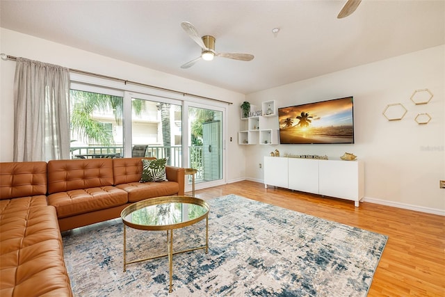 living room with hardwood / wood-style flooring and ceiling fan