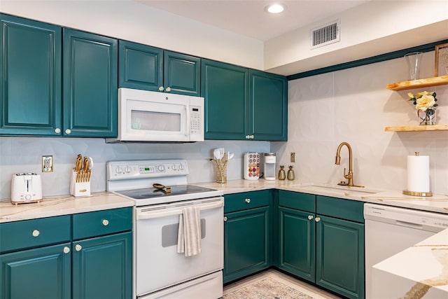 kitchen with white appliances and sink