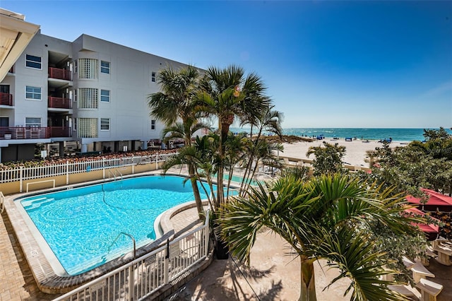 view of pool with a water view