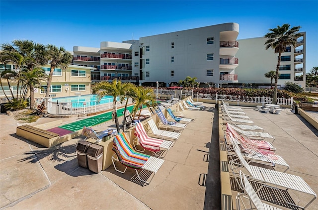 view of swimming pool with a patio