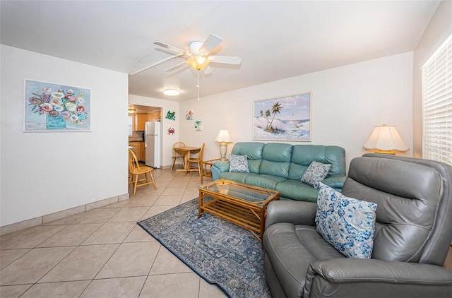 living room featuring light tile flooring and ceiling fan