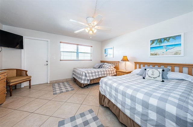 tiled bedroom with ceiling fan