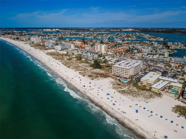 birds eye view of property with a beach view and a water view