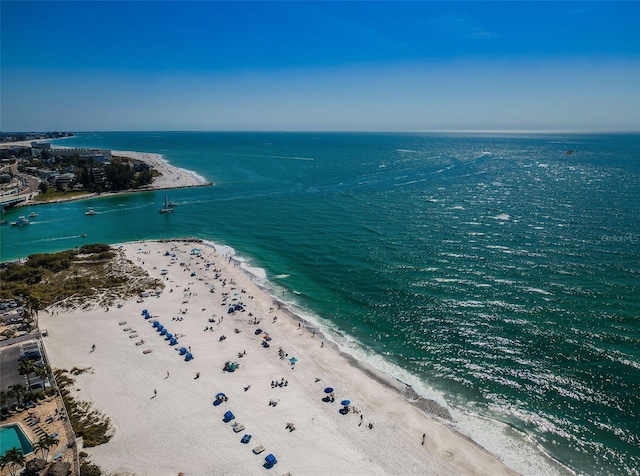 drone / aerial view with a beach view and a water view