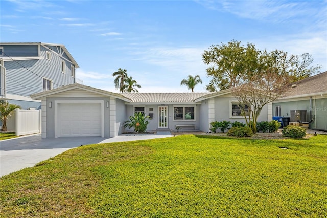 ranch-style home featuring a garage and a front lawn