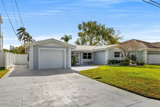 ranch-style house with a front yard and a garage