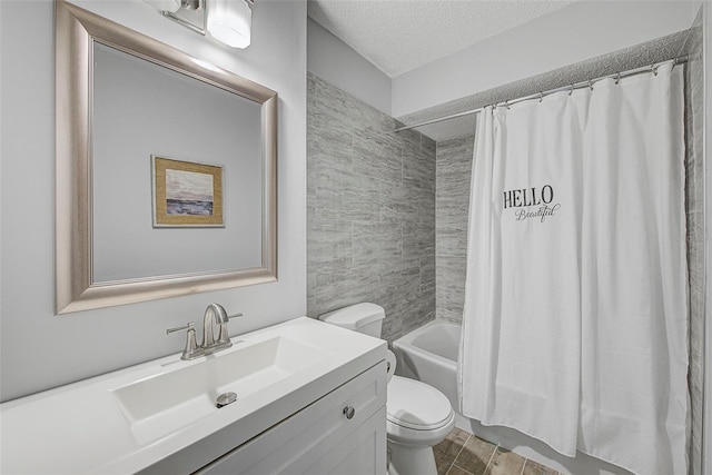 full bathroom featuring toilet, a textured ceiling, vanity, shower / bath combination with curtain, and tile flooring