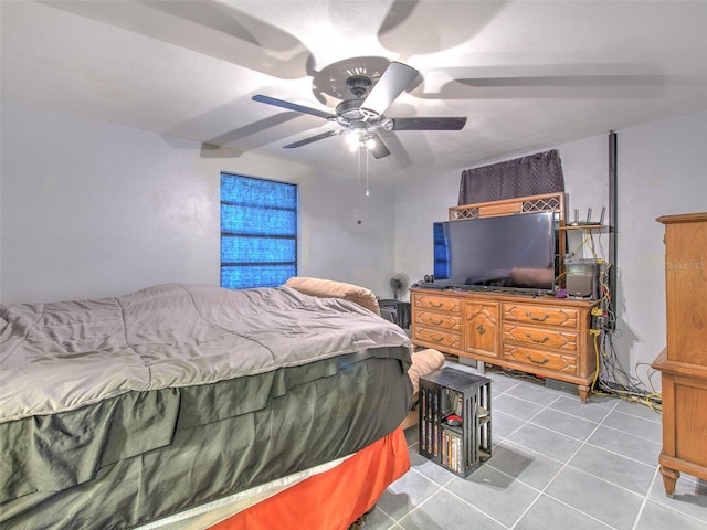 bedroom with light tile flooring and ceiling fan