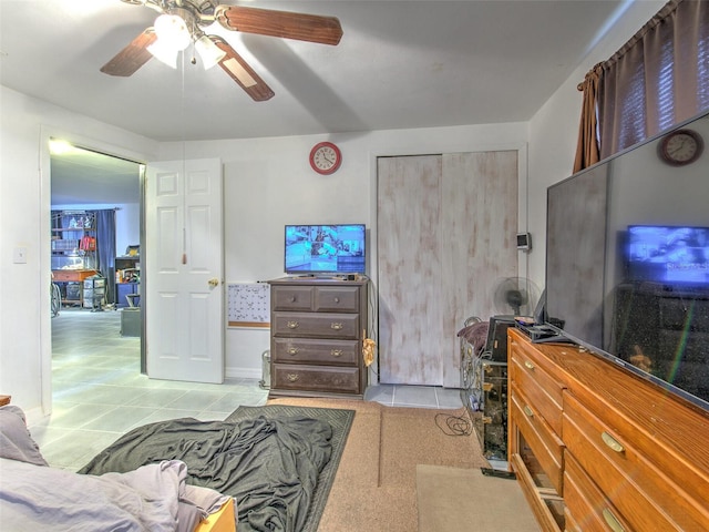 bedroom with light tile flooring and ceiling fan