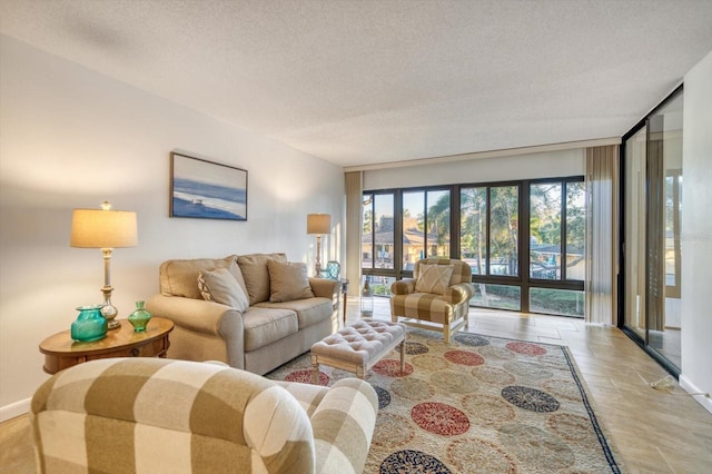 living room featuring light tile flooring and a textured ceiling