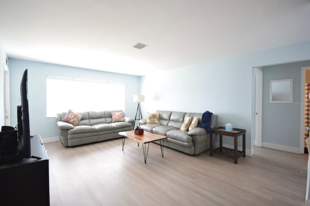 living room with light hardwood / wood-style floors