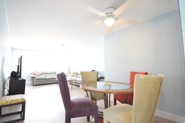 dining room featuring ceiling fan