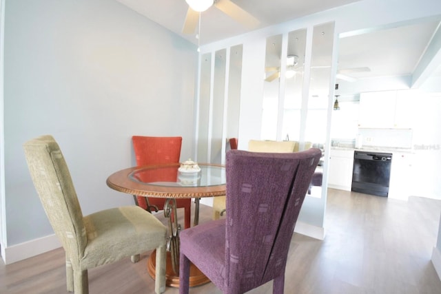 dining space featuring hardwood / wood-style flooring