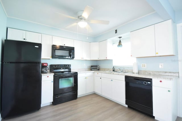 kitchen with black appliances, white cabinets, sink, light hardwood / wood-style flooring, and ceiling fan