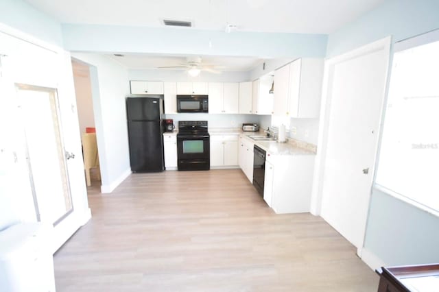 kitchen featuring white cabinetry, sink, ceiling fan, and black appliances