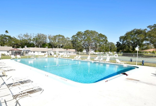 view of swimming pool featuring a patio area