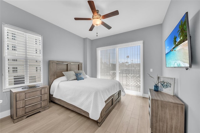 bedroom with ceiling fan and light wood-type flooring