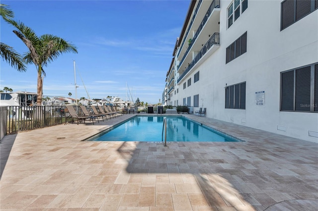 view of swimming pool featuring a patio