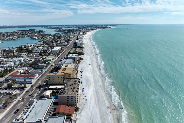 bird's eye view with a water view and a beach view