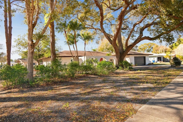 ranch-style house featuring a garage