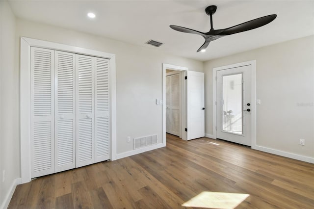 unfurnished bedroom featuring ceiling fan and hardwood / wood-style floors