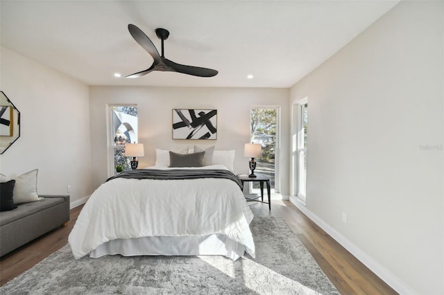 bedroom with ceiling fan and hardwood / wood-style floors