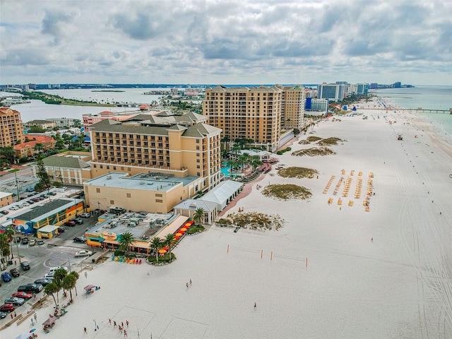 bird's eye view featuring a water view and a view of the beach