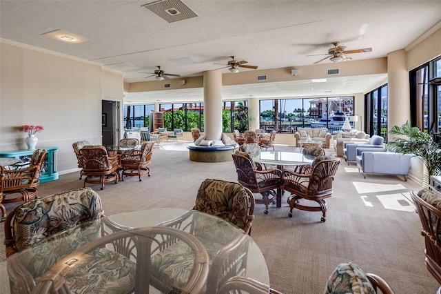 interior space with outdoor lounge area and ceiling fan