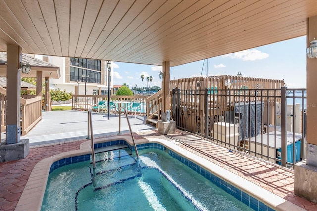 view of pool featuring a community hot tub