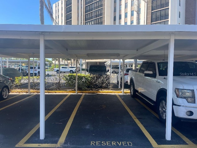 view of vehicle parking featuring a carport