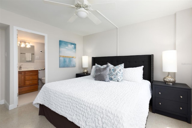 bedroom with connected bathroom and ceiling fan