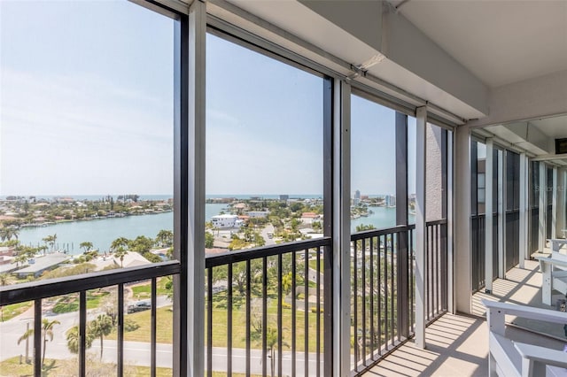 sunroom / solarium with a water view