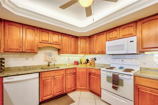 kitchen with white appliances, tasteful backsplash, ceiling fan, and sink