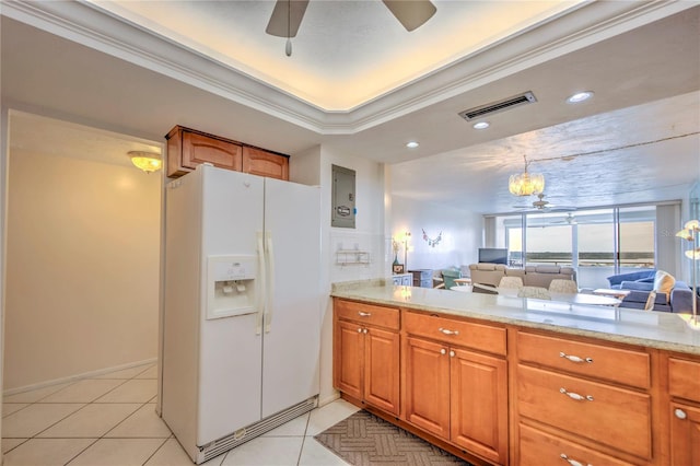 kitchen featuring light tile flooring, ceiling fan, white fridge with ice dispenser, crown molding, and light stone counters