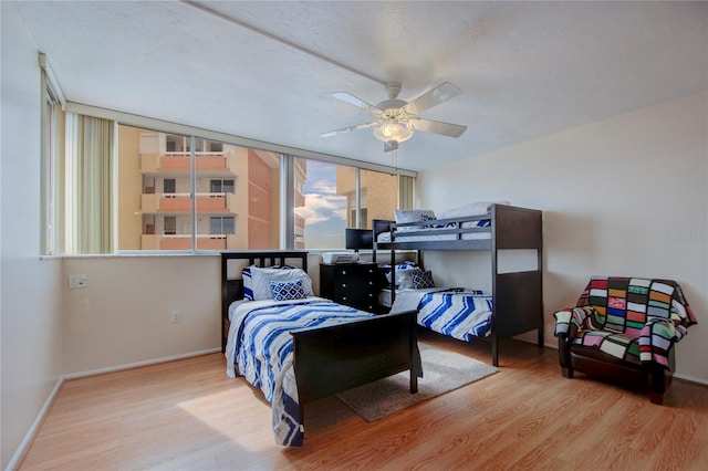 bedroom featuring light hardwood / wood-style floors and ceiling fan