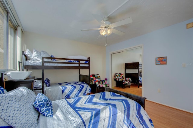 bedroom featuring a closet, ceiling fan, and hardwood / wood-style flooring