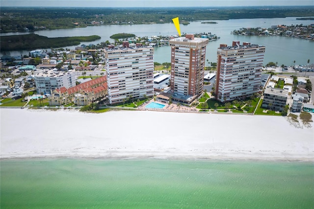 bird's eye view with a water view and a beach view