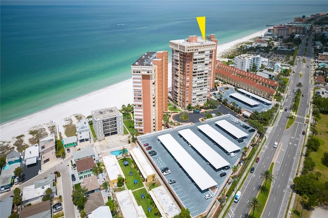 bird's eye view featuring a water view and a view of the beach